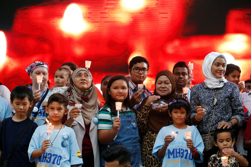 Family members hold candles during the fifth annual remembrance event for the missing Malaysia Airlines flight MH370, in Kuala Lumpur, Malaysia March 3, 2019. REUTERS/Lai Seng Sin