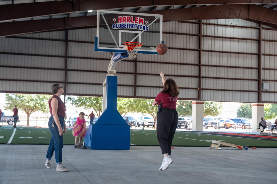 Two people test the new facility for basketball Friday at the grand opening the Pavilion at the Santa Fe Depot in downtown Amarillo.