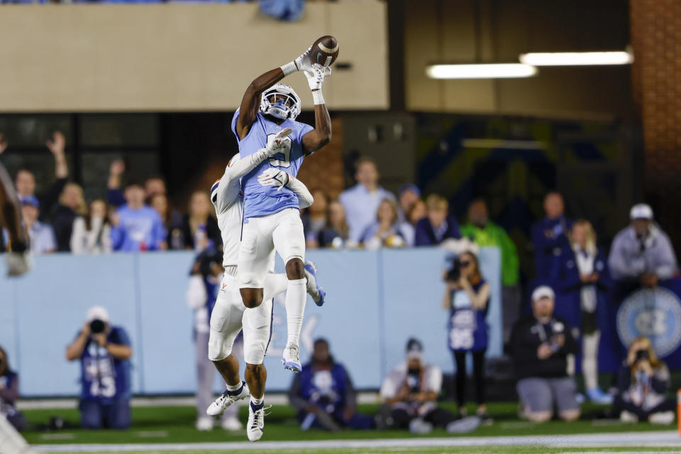 Oct 21, 2023; Chapel Hill, North Carolina, USA; North Carolina Tar Heels wide receiver Devontez Walker (9) tries to make a catch against the Virginia Cavaliers ub the first half at Kenan Memorial Stadium. Mandatory Credit: Nell Redmond-USA TODAY Sports