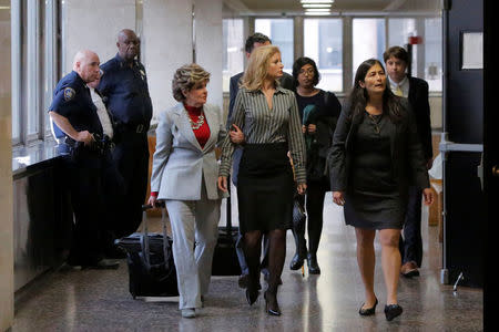 Summer Zervos (C), a former contestant on The Apprentice, arrives at New York State Supreme Court with attorney Gloria Allred (L) as a judge considers throwing out a defamation case against U.S. President Donald Trump in Manhattan, New York City, U.S., December 5, 2017. REUTERS/Andrew Kelly