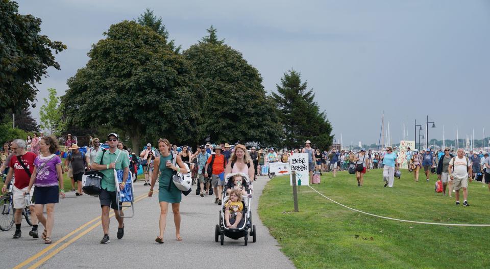 People leave Fort Adams State Park after the Newport Folk Festival.