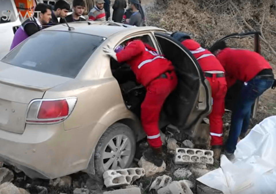 An image from video posted online by Syrian activists in Idlib province shows people inspecting a sedan damaged heavily by a purported U.S. airstrike on Feb. 26, 2017. There were unconfirmed reports that al Qaeda deputy leader Abdullah Muhammad Rajab Abdulrahman, aka Abu al-Khayr al-Masri, was killed in the strike.  
