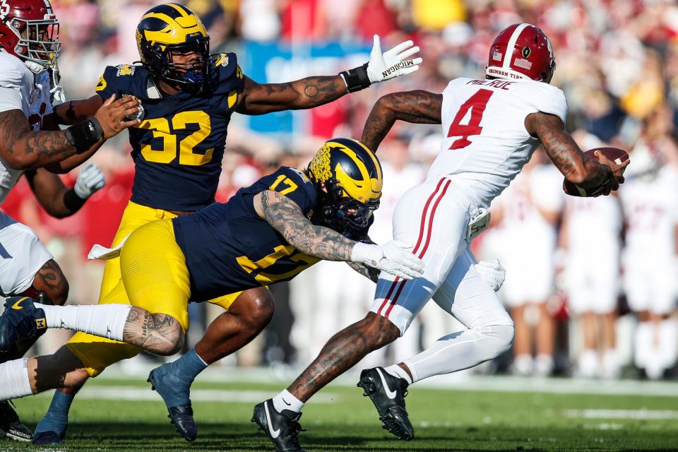 Michigan defensive end Braiden McGregor tackles Alabama quarterback <a class="link " href="https://sports.yahoo.com/ncaaf/players/323486/" data-i13n="sec:content-canvas;subsec:anchor_text;elm:context_link" data-ylk="slk:Jalen Milroe;sec:content-canvas;subsec:anchor_text;elm:context_link;itc:0">Jalen Milroe</a> during the first half of the Rose Bowl in Pasadena, California, on Monday, Jan. 1, 2024.