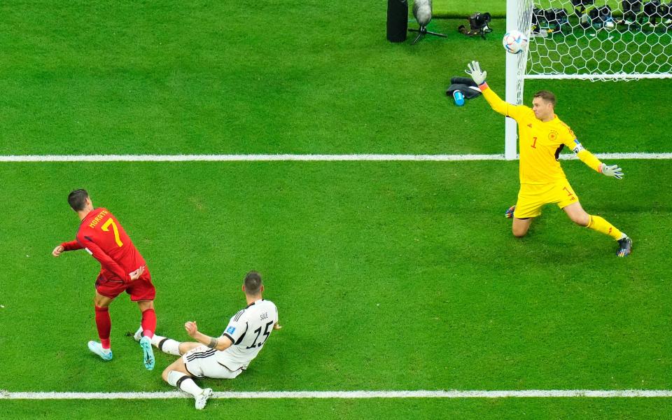 Spain's Alvaro Morata scores the opening goal past Germany's goalkeeper Manuel Neuer - Petr David Josek/AP