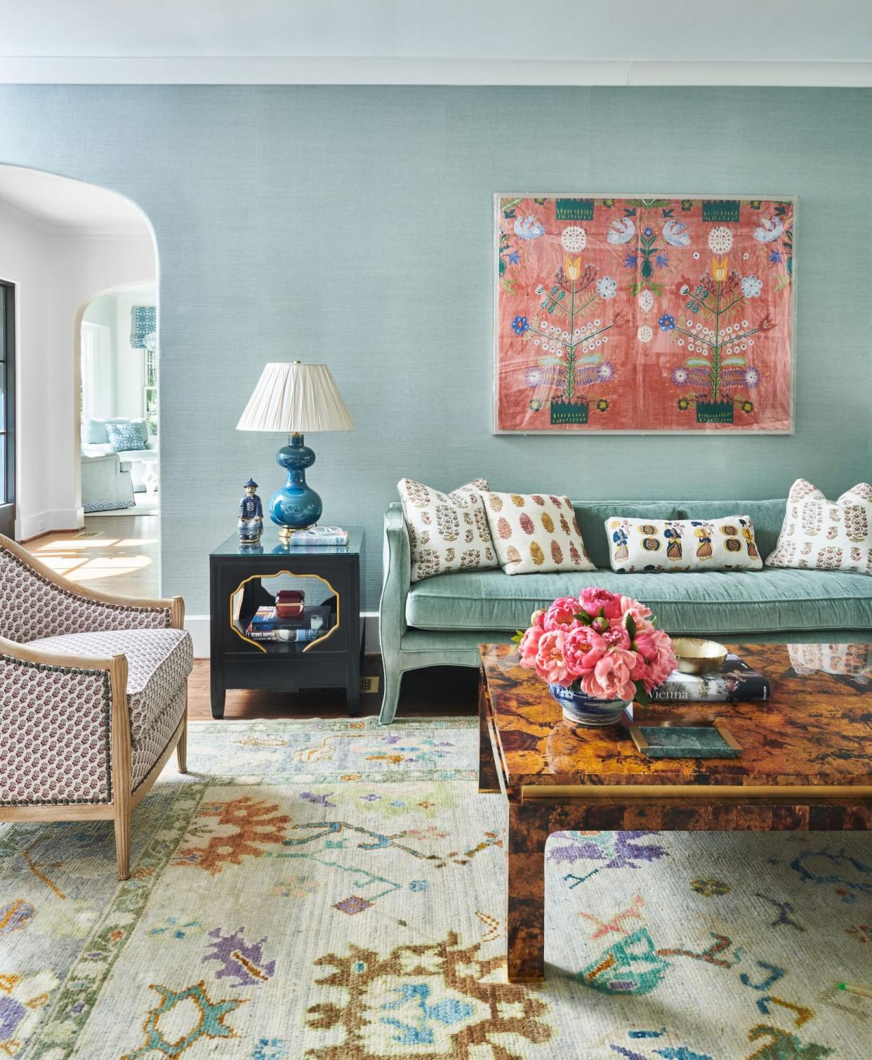 Teal grasscloth walls with accents of pink