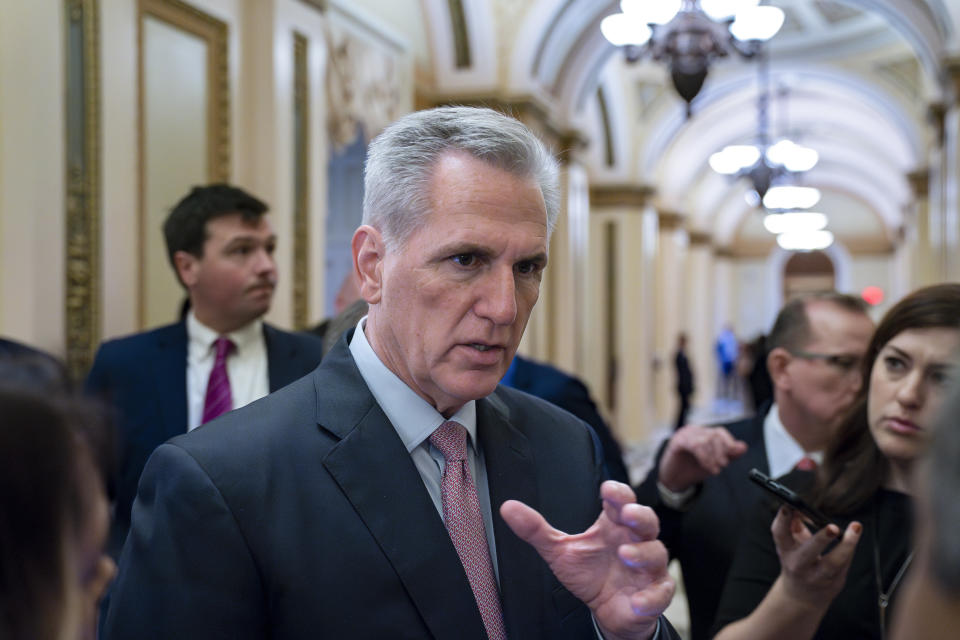 FILE - Speaker of the House Kevin McCarthy, R-Calif., talks with reporters at the Capitol in Washington, April 28, 2023. House Republicans are touting their debt limit package as a first step toward fiscal restraint. They say it's past time for Congress to reduce the swelling deficits that they say are threatening the fiscal health of the country. But a group of Midwestern Republicans went to McCarthy's office this week on a mission to preserve billions of dollars in federal support for biofuels and ethanol. (AP Photo/J. Scott Applewhite, File)