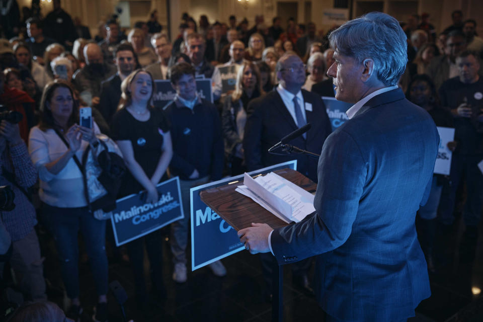 Democratic Congressman Tom Malinowski, right, speaks during his election night party in Garwood, N.J., Tuesday, Nov. 8, 2022. (AP Photo/Andres Kudacki)