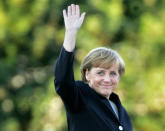 FILE - Angela Merkel arrives for a television debate with Chancellor Gerhard Schroeder at a television studio in Berlin, Sept. 4, 2005. As chancellor, Merkel has been credited with raising Germany’s profile and influence, helping hold a fractious European Union together, managing a string of crises and being a role model for women in a near-record tenure that ends with her leaving office amid praise from abroad and enduring popularity at home. Her designated successor Olaf Scholz is expected to take office Wednesday, Dec. 8, 2021. (AP Photo/Jockel Finck, File)