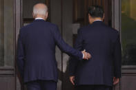 President Joe Biden walks with China's President President Xi Jinping after greeting him at the Filoli Estate in Woodside, Calif., Wednesday, Nov, 15, 2023, on the sidelines of the Asia-Pacific Economic Cooperative conference. (Doug Mills/The New York Times via AP, Pool)