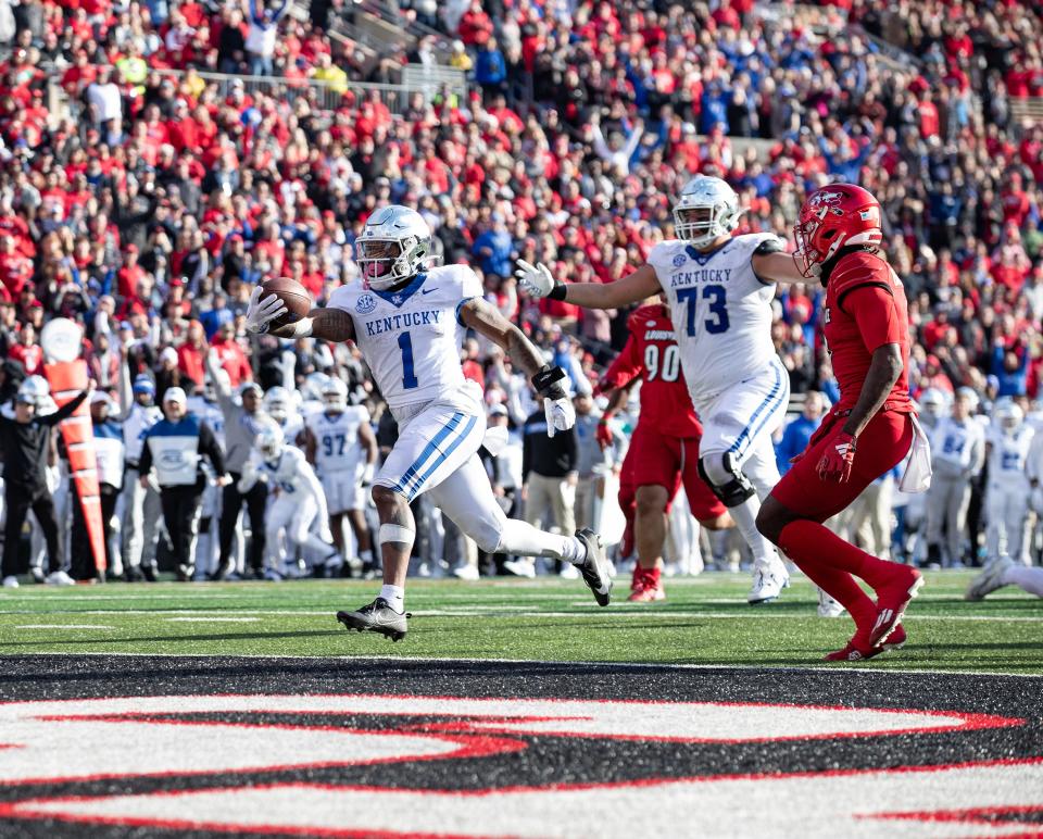 Kentucky's Ray Davis (1) raced across the goal line to give Kentucky a 31-24 lead in the second half as the Louisville Cardinals hosted the Kentucky Wildcats on Saturday afternoon at L&N Stadium in Louisville, Ky. Kentucky defeated Louisville 38-31. Nov. 25, 2023.