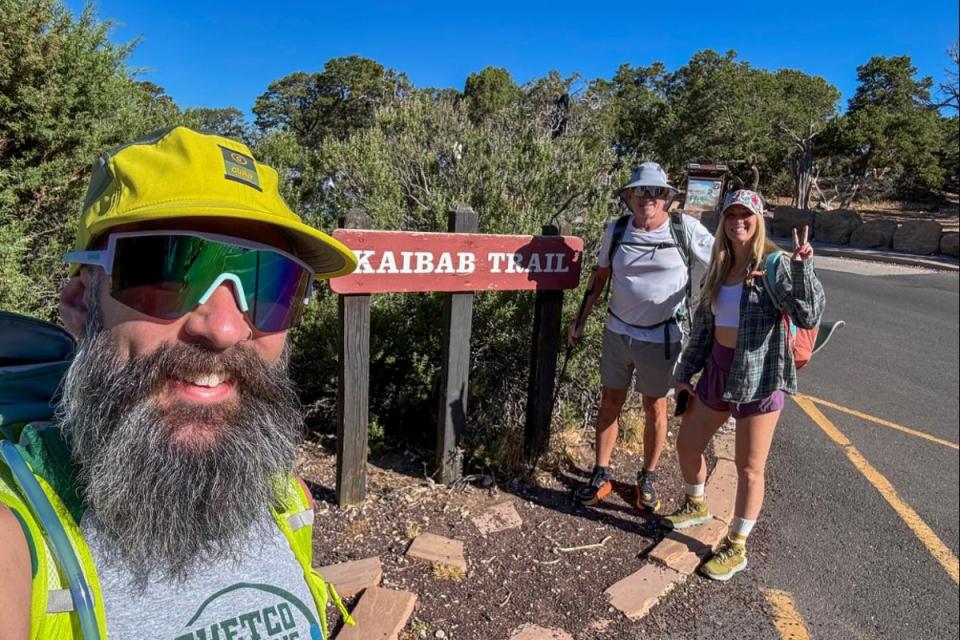Scott Sims (center right) is pictured with his niece Jessica Ryan, on a Grand Canyon trail, who issued a warning to other hikers following her uncle’s death (Jessica Ryan/ Facebook)