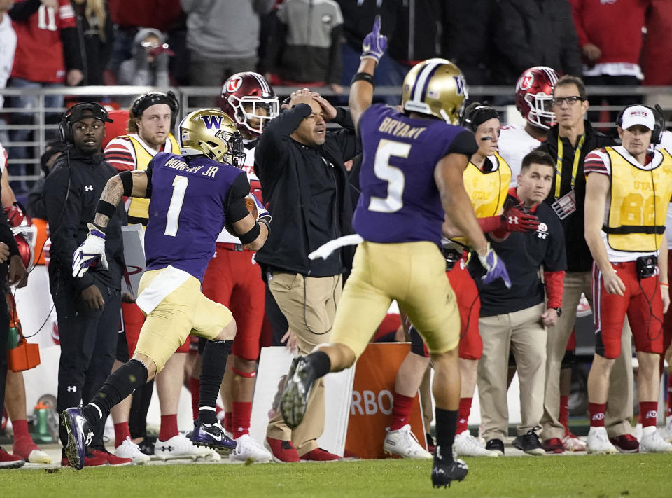 Washington defensive back Myles Bryant (5) celebrates as defensive back Byron Murphy (1) returns an interception for a touchdown against Utah during the second half of the Pac-12 Conference championship NCAA college football game in Santa Clara, Calif., Friday, Nov. 30, 2018. (AP Photo/Tony Avelar)