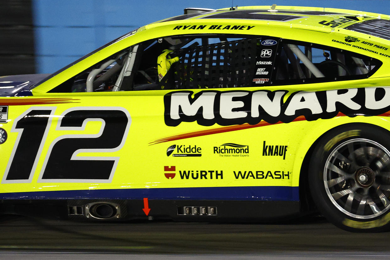 FORT WORTH, TEXAS - MAY 22: Ryan Blaney, driver of the #12 Menards/Wrangler Ford, attempts to replace his window net after a caution on the final lap and before overtime in the NASCAR Cup Series All-Star Race at Texas Motor Speedway on May 22, 2022 in Fort Worth, Texas. (Photo by Jared C. Tilton/Getty Images)