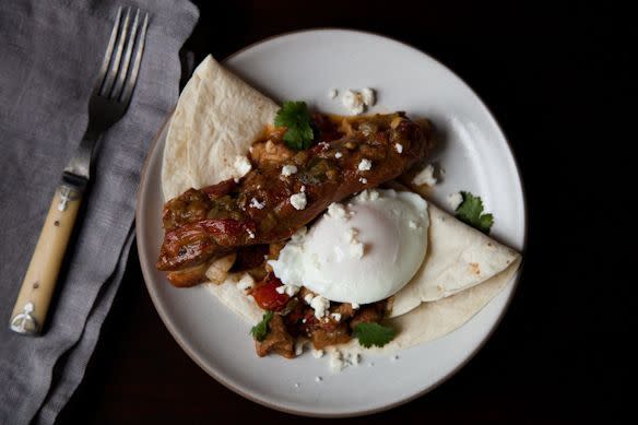 <p><i><b><b>Huevos Rancheros</b><br></b></i></p><p>This is the kind of recipe every cook should have in their arsenal. Especially for days like New Year’s. Try the <i><b><b><a href="https://www.food52.com/recipes/13594-huevos-rancheros-country-style-eggs-topped-with-pork-and-green-chile?utm_source=yahoofood&utm_medium=referral&utm_campaign=10hangoverhelpers" rel="nofollow noopener" target="_blank" data-ylk="slk:Huevos Rancheros;elm:context_link;itc:0;sec:content-canvas" class="link ">Huevos Rancheros</a>. </b></b></i><i>(Photo: Jennifer Causey/Food52)</i></p>