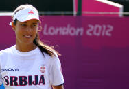 LONDON, ENGLAND - JULY 26: Ana Ivanovic of Serbia smiles during the practice session ahead of the 2012 London Olympic Games at the All England Lawn Tennis and Croquet Club in Wimbledon on July 26, 2012 in London, England. (Photo by Clive Brunskill/Getty Images)