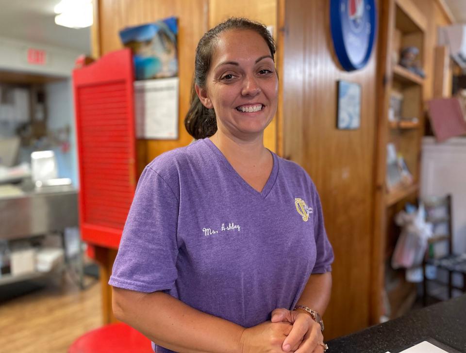 Carole's Country Cupboard co-owner Ashley Cook stands behind the counter at her restaurant in Nicholson, Ga. on Tuesday, Aug. 15, 2023.