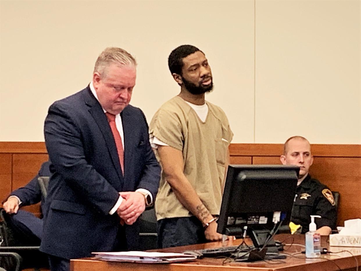 Christopher L. Payne, 27, of Columbus' Near East Side, center, stands with his defense attorney, Jeffrey M. Blosser, left, during his appearance Friday in Franklin County Common Pleas Court. Payne was sentenced to life in prison for his conviction on one count of murder in the death of an unborn baby and two counts of attempted murder in an Aug. 23, 2020 shooting on the city's Northeast Side.