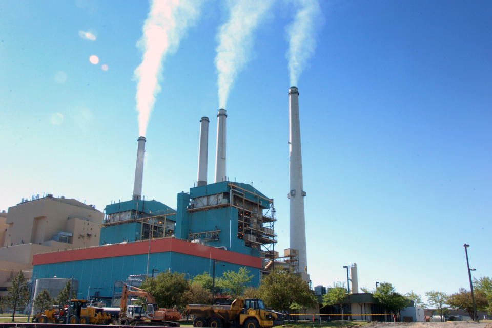 FILE - This July 1, 2013 file photo shows smoke rises from the Colstrip Steam Electric Station, a coal burning power plant in in Colstrip, Mont. The Supreme Court on Tuesday handed the Obama administration an important victory in its effort to reduce power plant pollution that contributes to unhealthy air in neighboring states. In a 6-2 decision, the court upheld a rule adopted by the Environmental Protection Agency in 2011 to limit emissions from plants in more than two-dozen Midwestern and Southern states. The pollution drifts into the air above states along the East Coast, and the EPA has long struggled to devise a way to control it. (AP Photo/Matthew Brown, File)