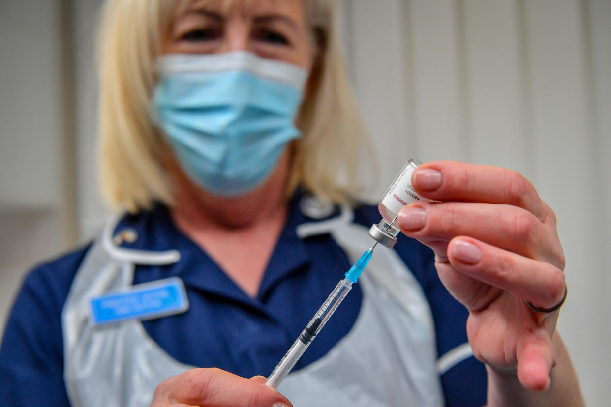 Practice Nurse Tina Sutton draws off a single dose from a vial, which can provide 10 individual doses to patients, of the Oxford University/AstraZeneca COVID-19 vaccine, being used at the Pontcae Medical Practice in Merthyr Tydfil as the NHS ramps up its vaccination programme with 530,000 doses of the newly approved jab available for rollout across the UK.