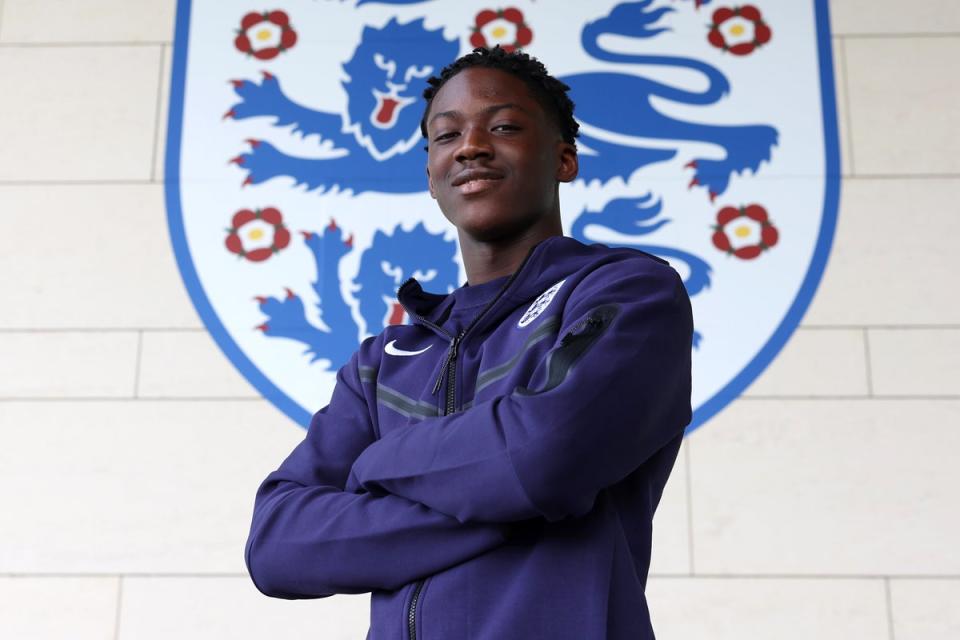 Kobbie Mainoo poses for photos at St George’s Park after his late call-up (Getty)