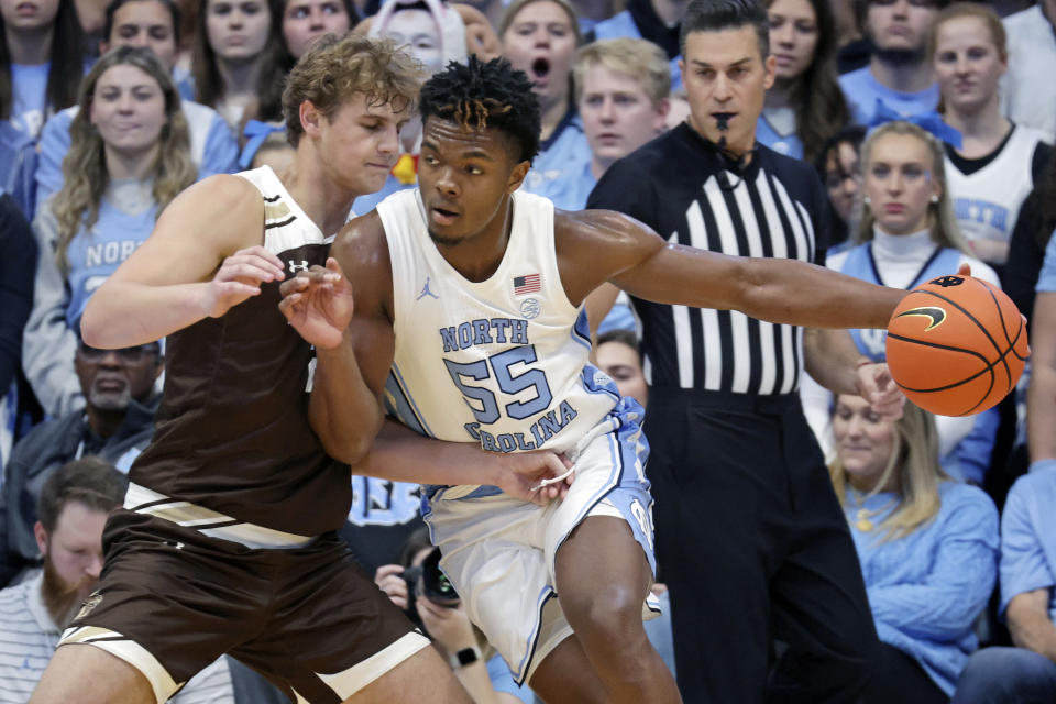 North Carolina forward Harrison Ingram (55) drives against Lehigh forward Burke Chebuhar, left, during the second half of an NCAA college basketball game Sunday, Nov. 12, 2023, in Chapel Hill, N.C. (AP Photo/Chris Seward)