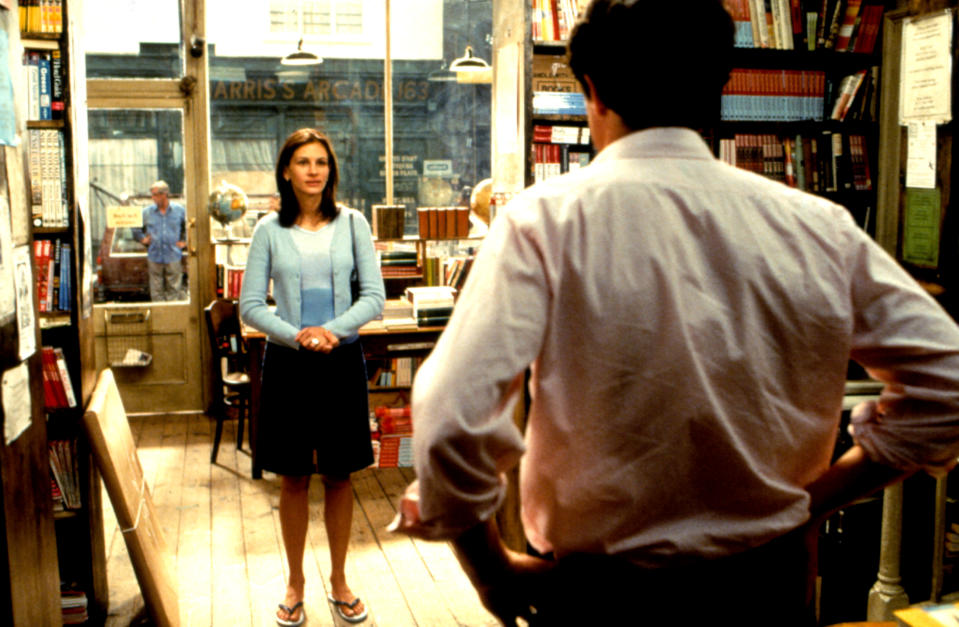 Julia Roberts faces Hugh Grant in bookstore in screenshot from film Notting Hill. 