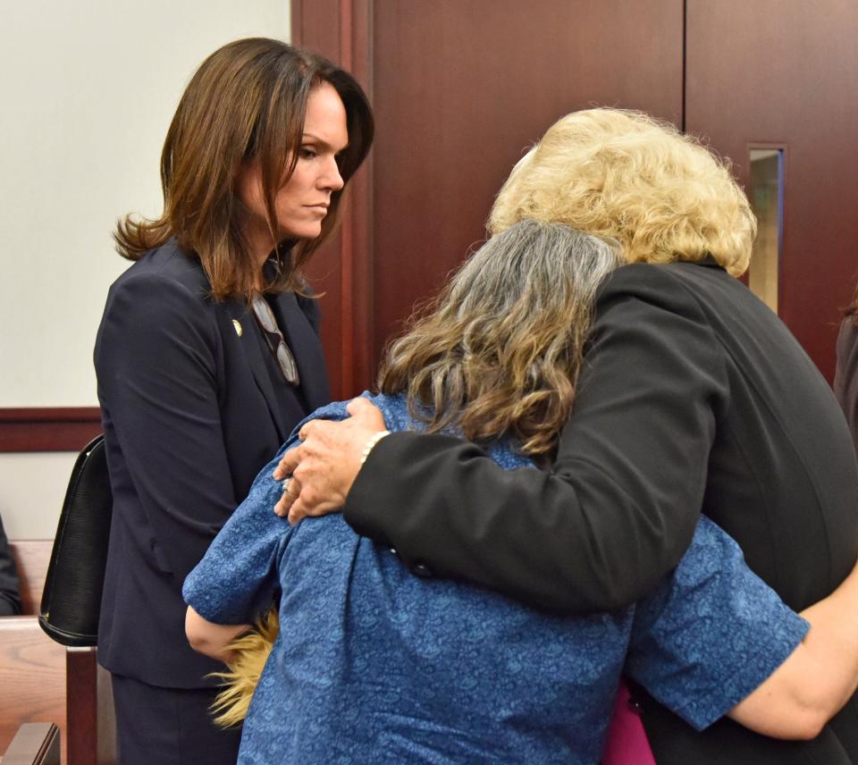 Kay Welsh, center, gets a hug from Ann Dugger alongside State Attorney Melissa Nelson after the Sept. 18, 2019, sentencing of Donald Davidson Jr. in the 2014 murder of daughter Roseann Kasama Welsh.