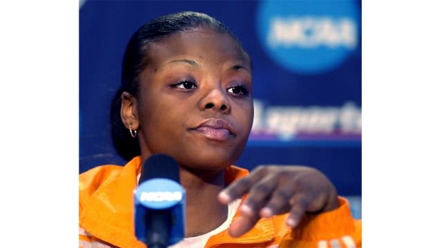 Tasha Butts answers questions after a basketball game.