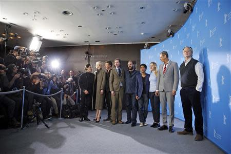 Actors Willem Dafoe, Tilda Swinton, Edward Norton, director Wes Anderson, Ralph Fiennes, Tony Revolori, Saoirse Ronan, Jeff Goldblum and Bill Murray (L-R) pose to promote the movie "The Grand Budapest Hotel" at the 64th Berlinale International Film Festival in Berlin February 6, 2014. REUTERS/Thomas Peter