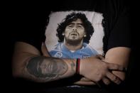 The Wider Image: Argentines celebrate 'eternal love' for Maradona with tattoos