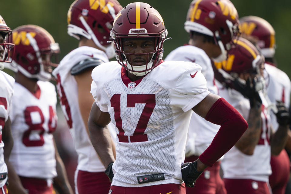 Washington Commanders wide receiver Terry McLaurin listens during a drill at an NFL football practice at the team's training facility, Tuesday, Aug. 1, 2023, in Ashburn, Va. (AP Photo/Evan Vucci)