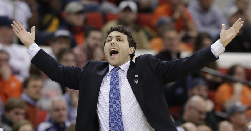 Memphis head coach Josh Pastner calls a play against Virginia during the first half of an NCAA college basketball third-round tournament game, Sunday, March 23, 2014, in Raleigh. (AP Photo/Chuck Burton)