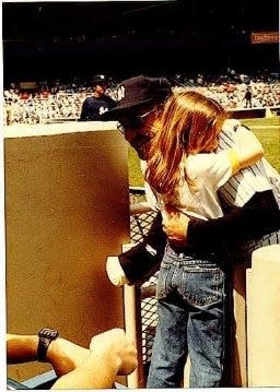 Lindsay Berra visits her grandfather, Yogi Berra, when he managed the Yankees during the summer of 1984.