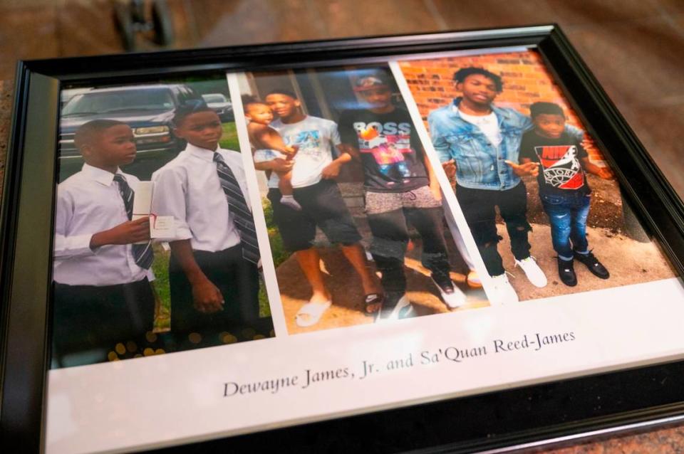 Family photos of brothers Dewayne James Jr. and Sa’Quan Reed-James were displayed at a vigil at Arden Fair mall on Saturday, Nov. 28. The two teenagers were fatally shot at the mall on Friday.