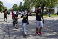 A small Black Lives Matter group marches outside the Grace Lutheran Church where Democratic presidential candidate former Vice President Joe Biden is scheduled to hold an event Thursday, Sept. 3, 2020, in Kenosha, Wis. (AP Photo/Morry Gash)
