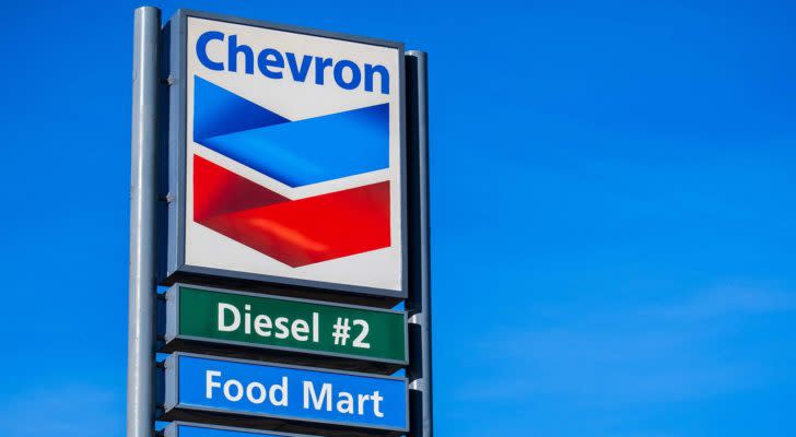 Chevron (CVX) logo on gas station sign with "diesel" and "food mart" written underneath