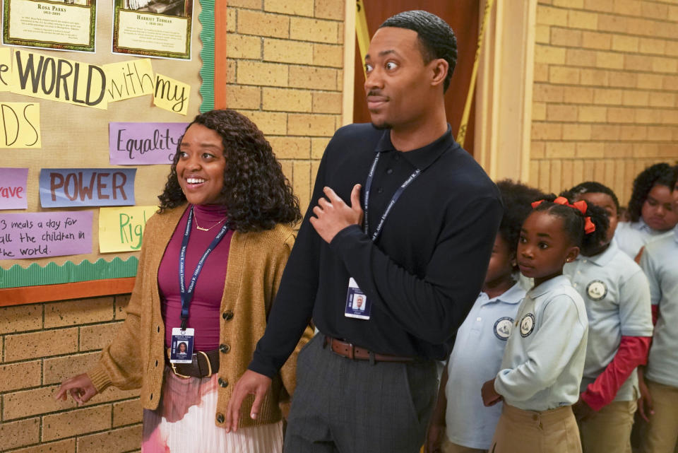 Characters taking their students in the hallway