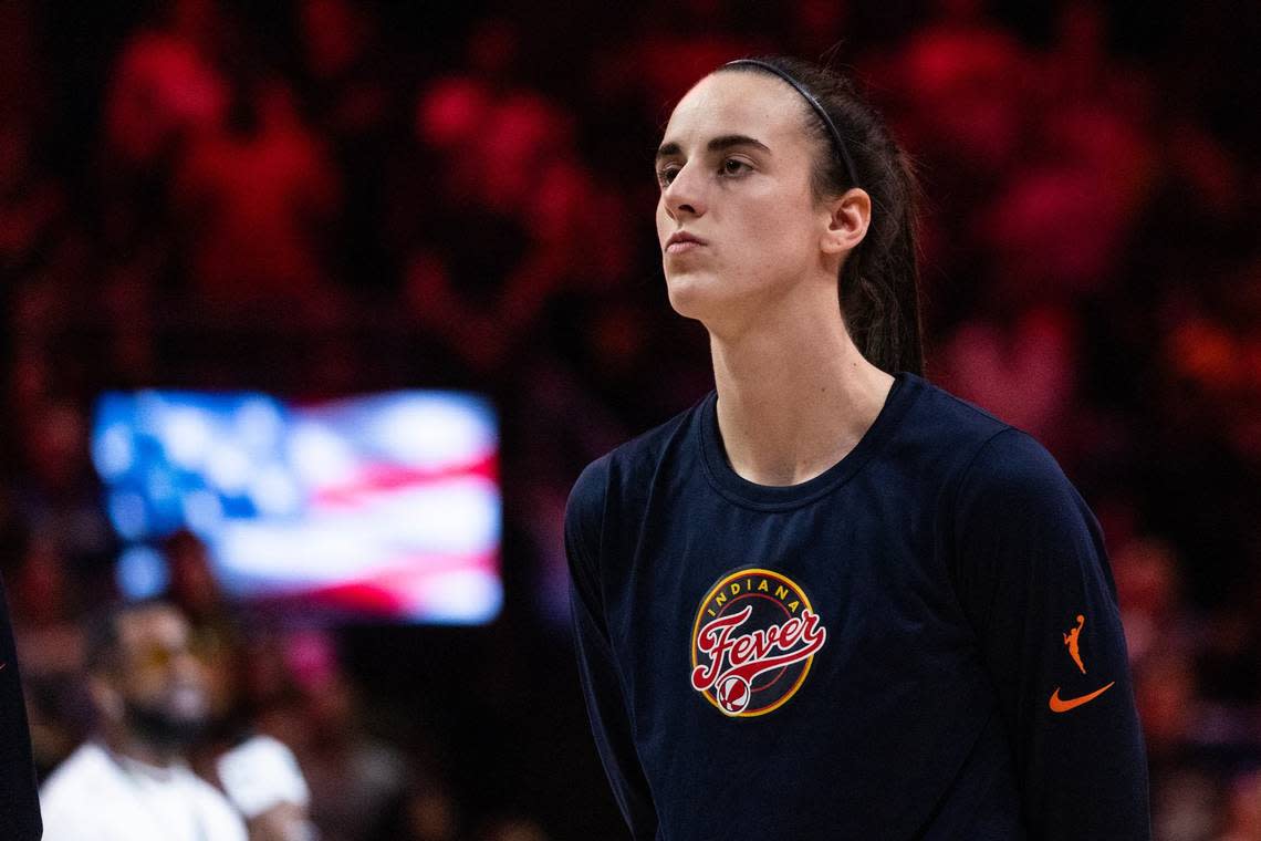 Indiana Fever guard Caitlin Clark stands on the court for the national anthem prior to a WNBA preseason game against the Dallas Wings at College Park Center in Arlington on Friday, May 3, 2024. Clark is making her highly anticipated professional debut after going as the number one pick in the 2024 draft.