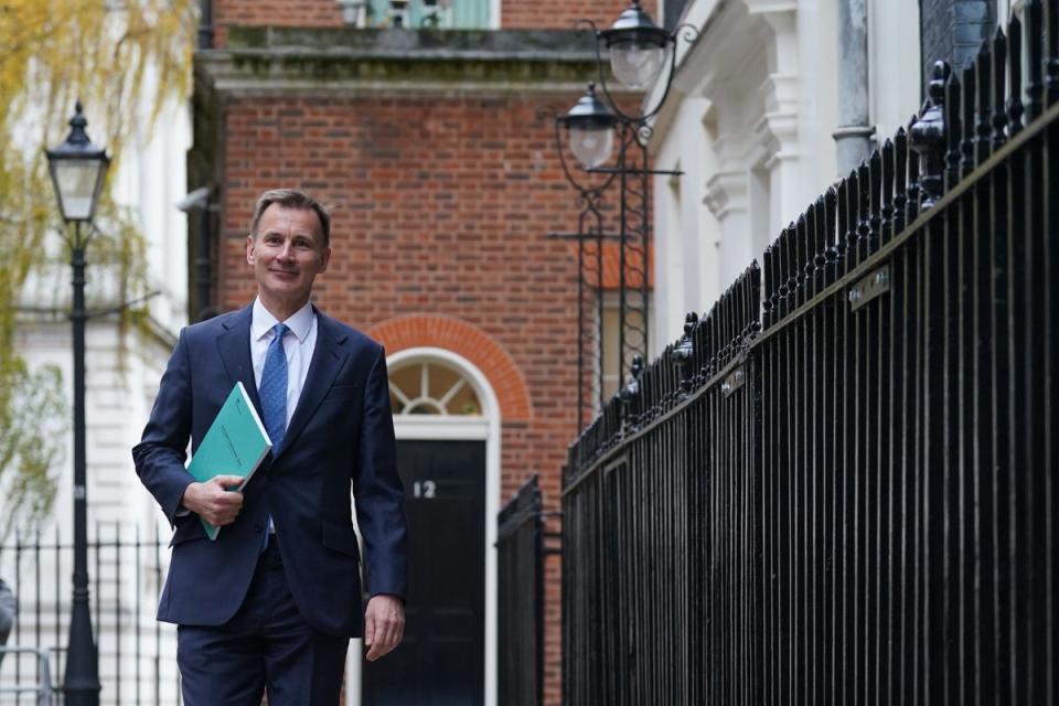 Chancellor of the Exchequer Jeremy Hunt leaves 11 Downing Street to deliver his autumn statement (Stefan Rousseau/PA)