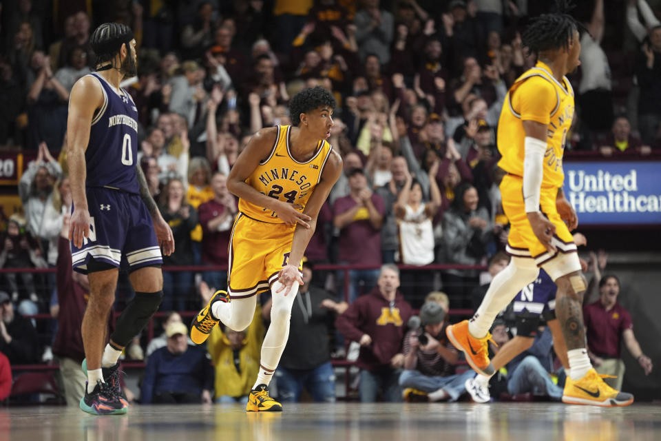 Minnesota guard Cam Christie (24) celebrates after making a 3-point basket during the second half of an NCAA college basketball game against Northwestern, Saturday, Feb. 3, 2024, in Minneapolis. (AP Photo/Abbie Parr)