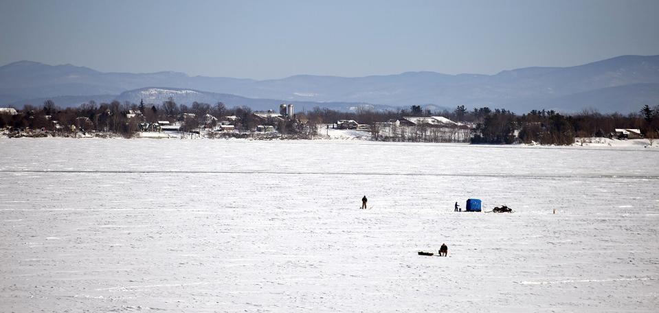 People Ice Fish on the Froze Lake Champlain Near Port Henry New York Usa 10 February 2013