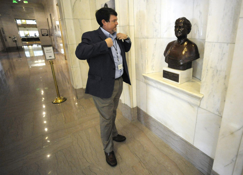 Steve Murray, director of the Alabama Department of Archives and History, pauses by a bust of former director Marie Bankhead Owen in Montgomery, Ala., on Thursday, Aug. 13, 2020. Murray and other current leaders of the agency are confronting the legacy of Owen, an ardent supporter of the "lost cause" version of Civil War history, as the nation grapples with the legacy of racial injustice. (AP Photo/Jay Reeves)