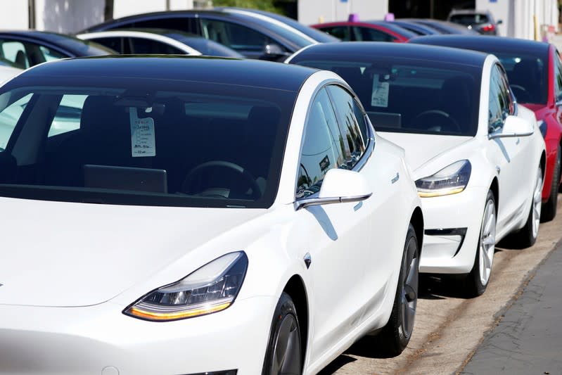 FILE PHOTO: FILE PHOTO: A new Tesla Model 3 is shown at a delivery center on the last day of the company's third quarter, in San Diego