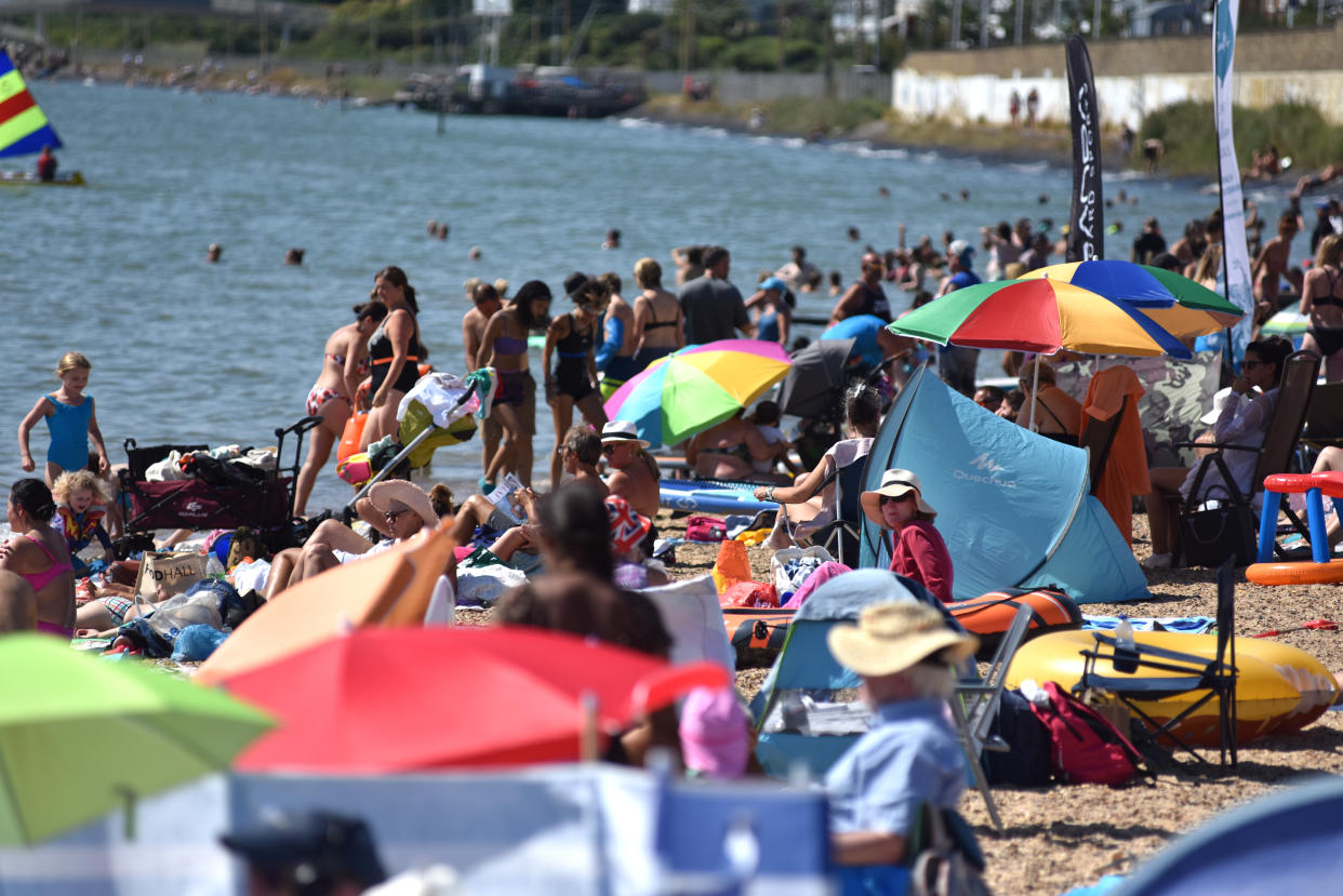 CHALKWELL, ENGLAND - AUGUST 13: Crowds of people gather on Chalkwell beach during the extreme hot weather on August 13, 2022 in Chalkwell, Southend, England. The Met Office, the UK's weather service, issued an amber extreme heat warning for southern and central England and parts of Wales from midnight on Thursday until Sunday. Temperatures are expected to reach up to 35C in some parts of the country. (Photo by John Keeble/Getty Images)