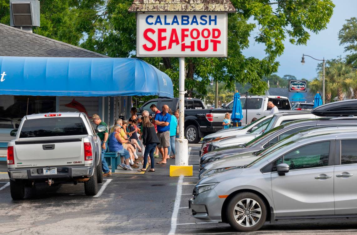 Visitors and vacationers line up to have dinner at the Calabash Seafood Hut on Thursday, June 27, 2024 in Calabash, N.C.