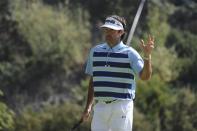 Feb 16, 2014; Pacific Palisades, CA, USA; Bubba Watson (USA) waves to the crowd after making a putt on the eighth hole during the fourth round of the Northern Trust Open at Riviera Country Club. Andrew Fielding-USA TODAY Sports