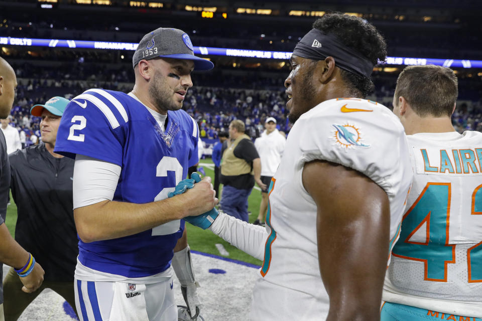 Indianapolis Colts quarterback Brian Hoyer (2) clasps hands with Miami Dolphins cornerback Eric Rowe following an NFL football game in Indianapolis, Sunday, Nov. 10, 2019. The Dolphins won 16-12. (AP Photo/Darron Cummings)