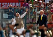 India's Prime Minister Narendra Modi waves next to U.S. President Donald Trump as they attend the "Namaste Trump" event at Sardar Patel Gujarat Stadium, in Ahmedabad