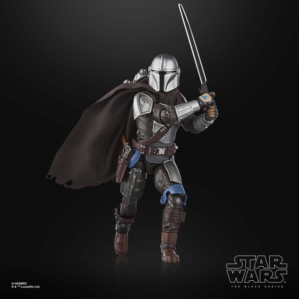 The Mandalorian action figure posed against a black background