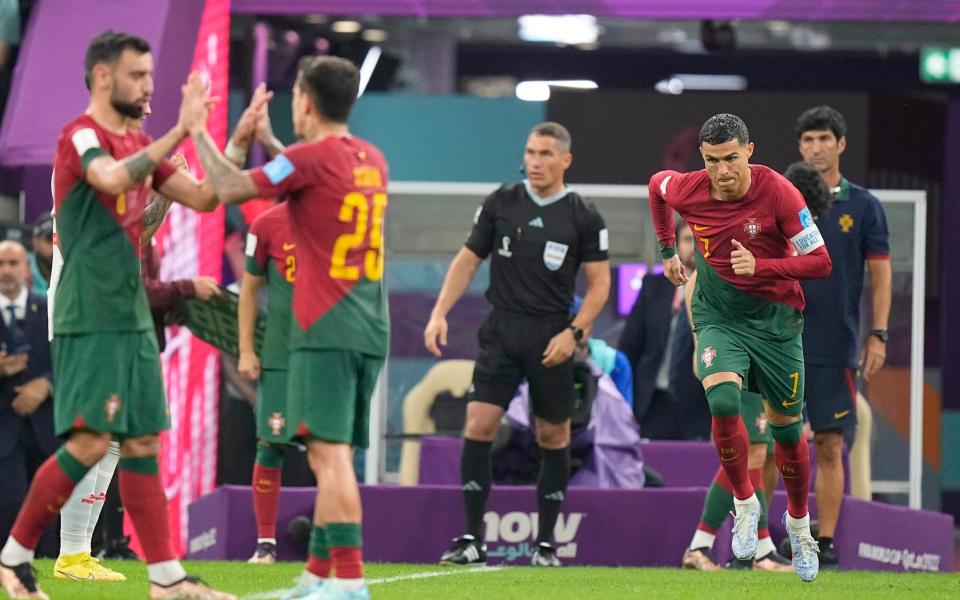 Portugal's Cristiano Ronaldo enters on the pitch during the World Cup round of 16 soccer match - AP